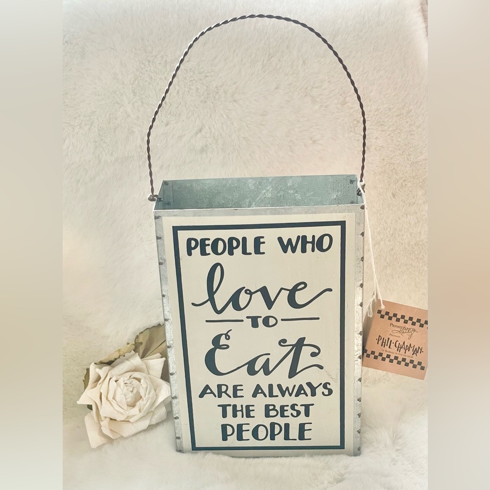 New with tag “PEOPLE WHO LOVE TO EAT ARE ALWAYS THE BEST PEOPLE” Metal CONTAINER
